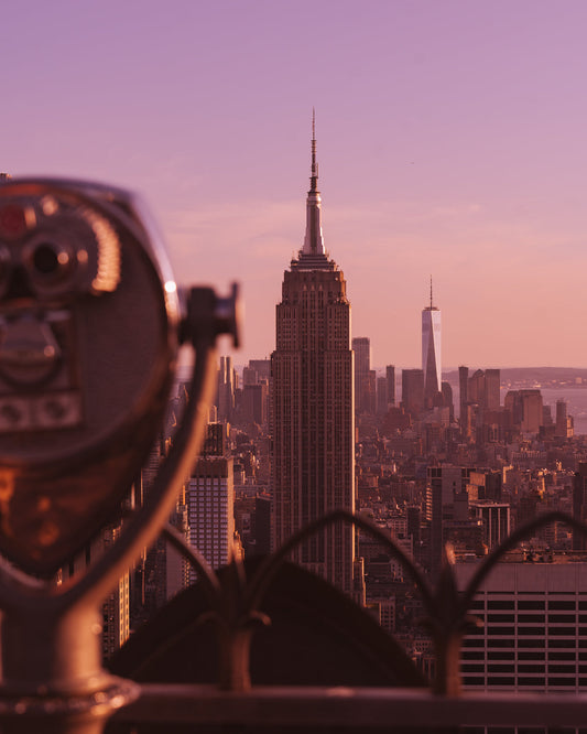 A viewfinder on the left, the Empire State Building in the center, and the World Trade Center on the right