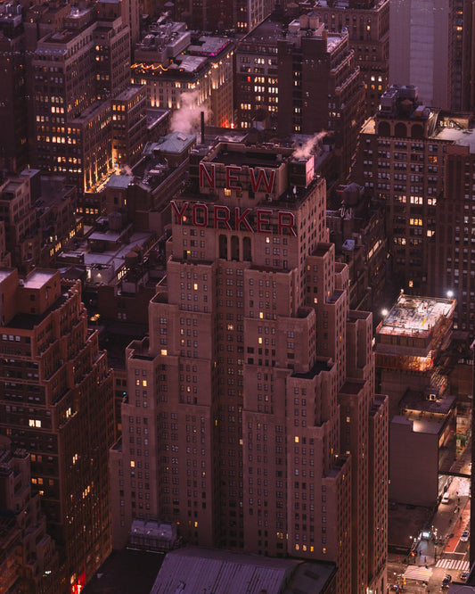 The New Yorker building lit up, shot from above