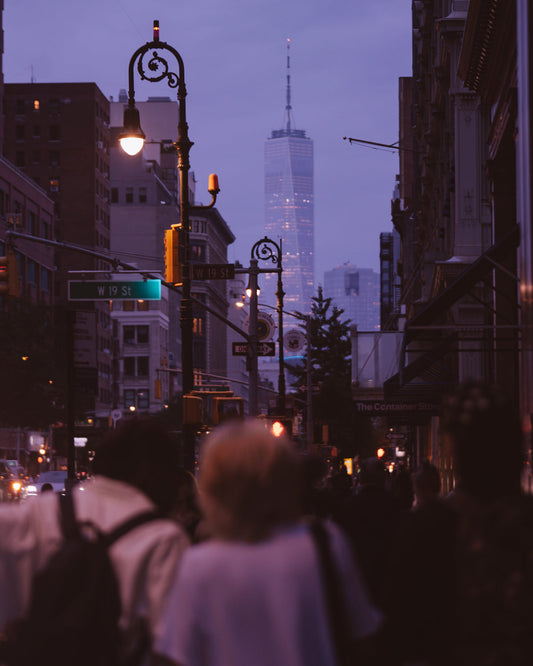 Three figures turned around looking south at the World Trade Center